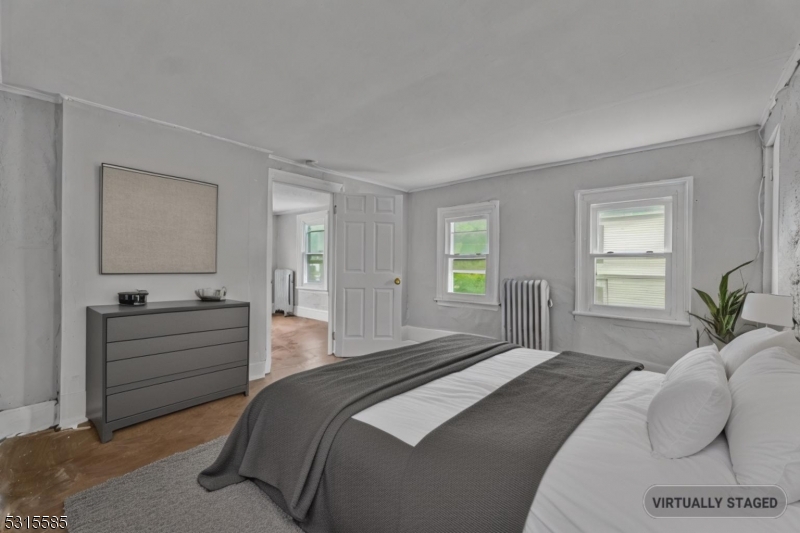 403 Seminary Avenue Rahway, NJ 07065 - Photo 18 of 29 a bedroom with a bed and a dresser