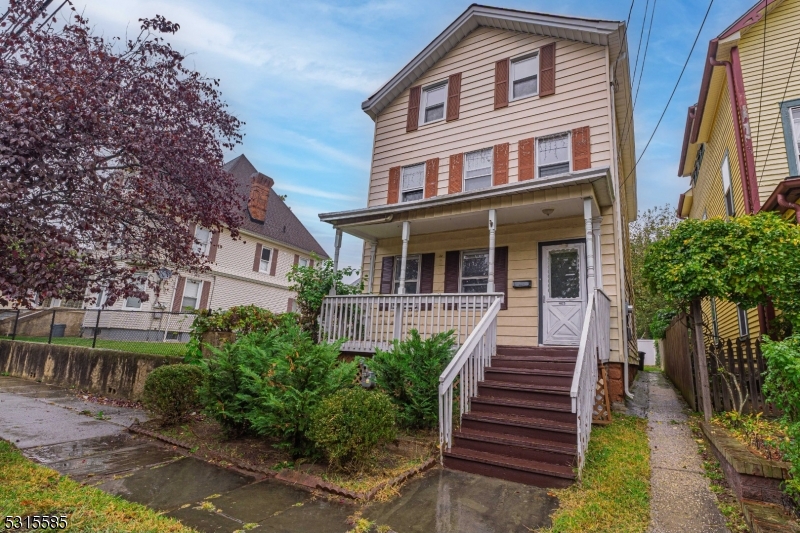 403 Seminary Avenue Rahway, NJ 07065 - Photo 2 of 29 a front view of a house with a yard