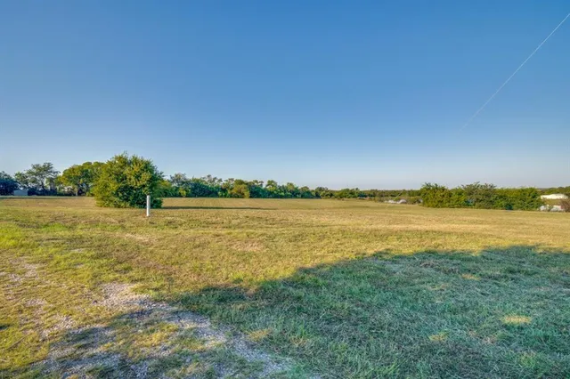 a view of a lake with houses in the back