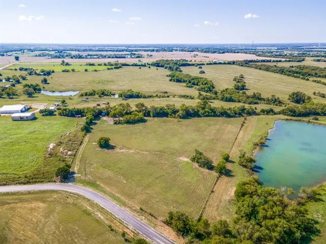 an aerial view of residential building with outdoor space and lake view