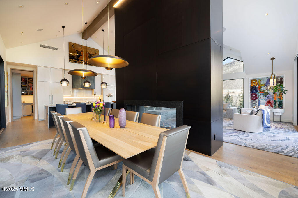 254 Beaver Dam Road Vail, CO 81657 - Photo 10 of 46 a dining room with furniture and wooden floor