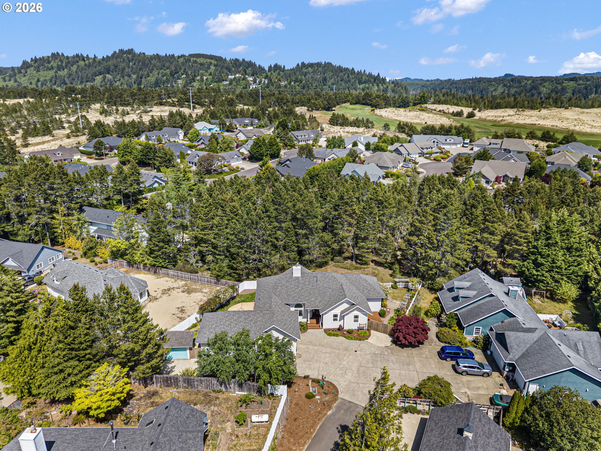 2218 Willow Loop Florence, OR 97439 - Photo 45 of 47 an aerial view of a city with lots of residential buildings