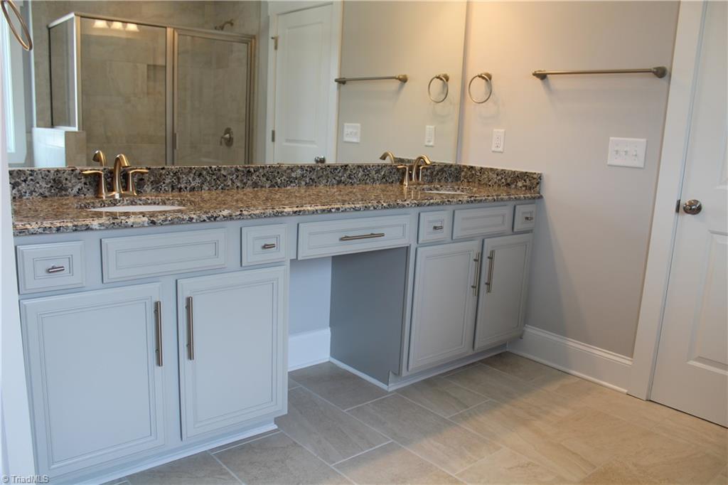 2621 Lunsford Road Summerfield, NC 27358 - Photo 11 of 30 Optional granite countertops with upgraded tile floor