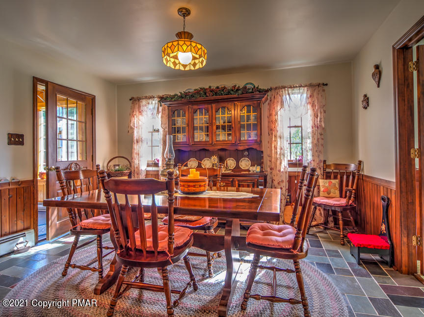 259 Babbling Brook Road Scotrun, PA 18355 - Photo 12 of 63 a view of a dining room with furniture and chandelier