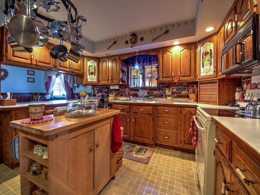 259 Babbling Brook Road Scotrun, PA 18355 - Photo 13 of 63 a kitchen that has a sink and a stove