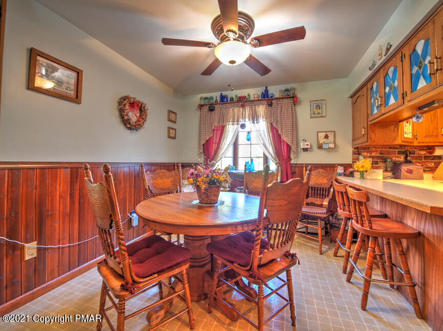 259 Babbling Brook Road Scotrun, PA 18355 - Photo 17 of 63 a dining room with furniture and wooden floor