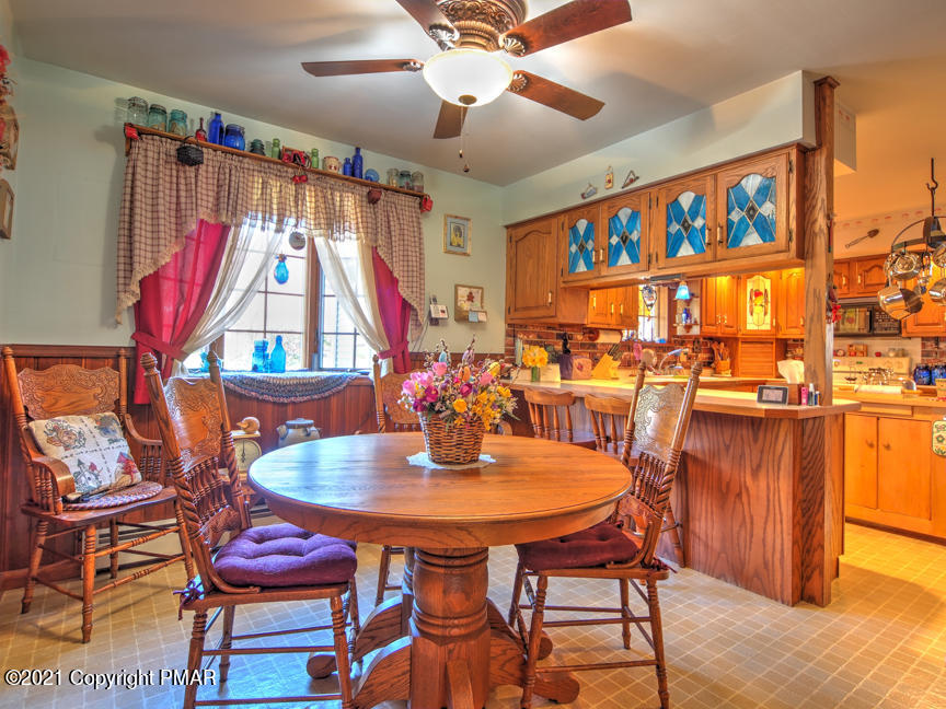 259 Babbling Brook Road Scotrun, PA 18355 - Photo 18 of 63 a view of a dining room with furniture and wooden floor