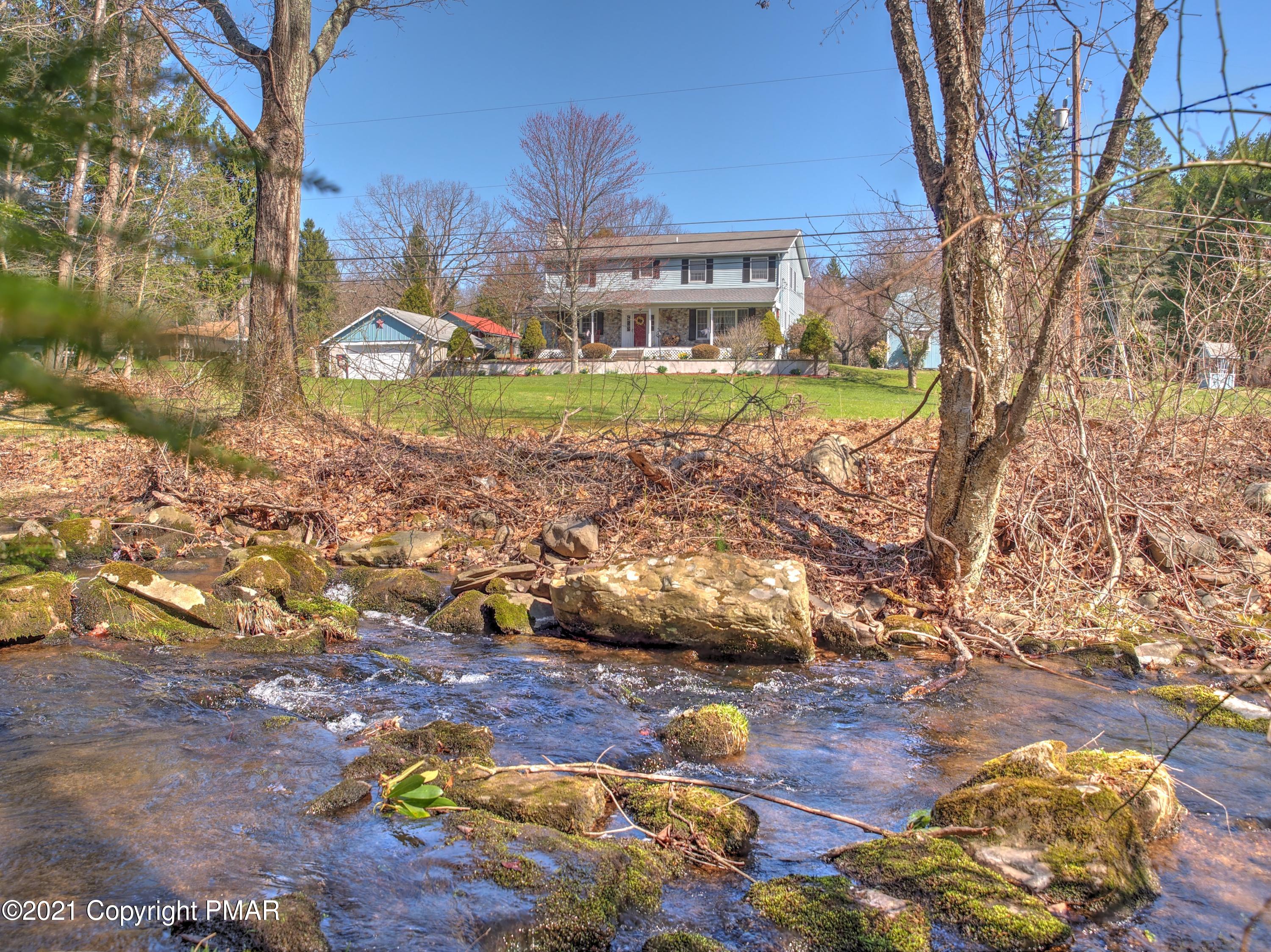 259 Babbling Brook Road Scotrun, PA 18355 - Photo 2 of 63 a view of a house with yard and sitting area