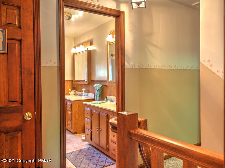 259 Babbling Brook Road Scotrun, PA 18355 - Photo 33 of 63 a bathroom with a sink a mirror and a shower
