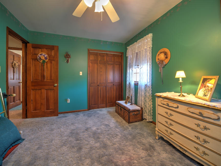 259 Babbling Brook Road Scotrun, PA 18355 - Photo 39 of 63 a room with a bed and a chandelier
