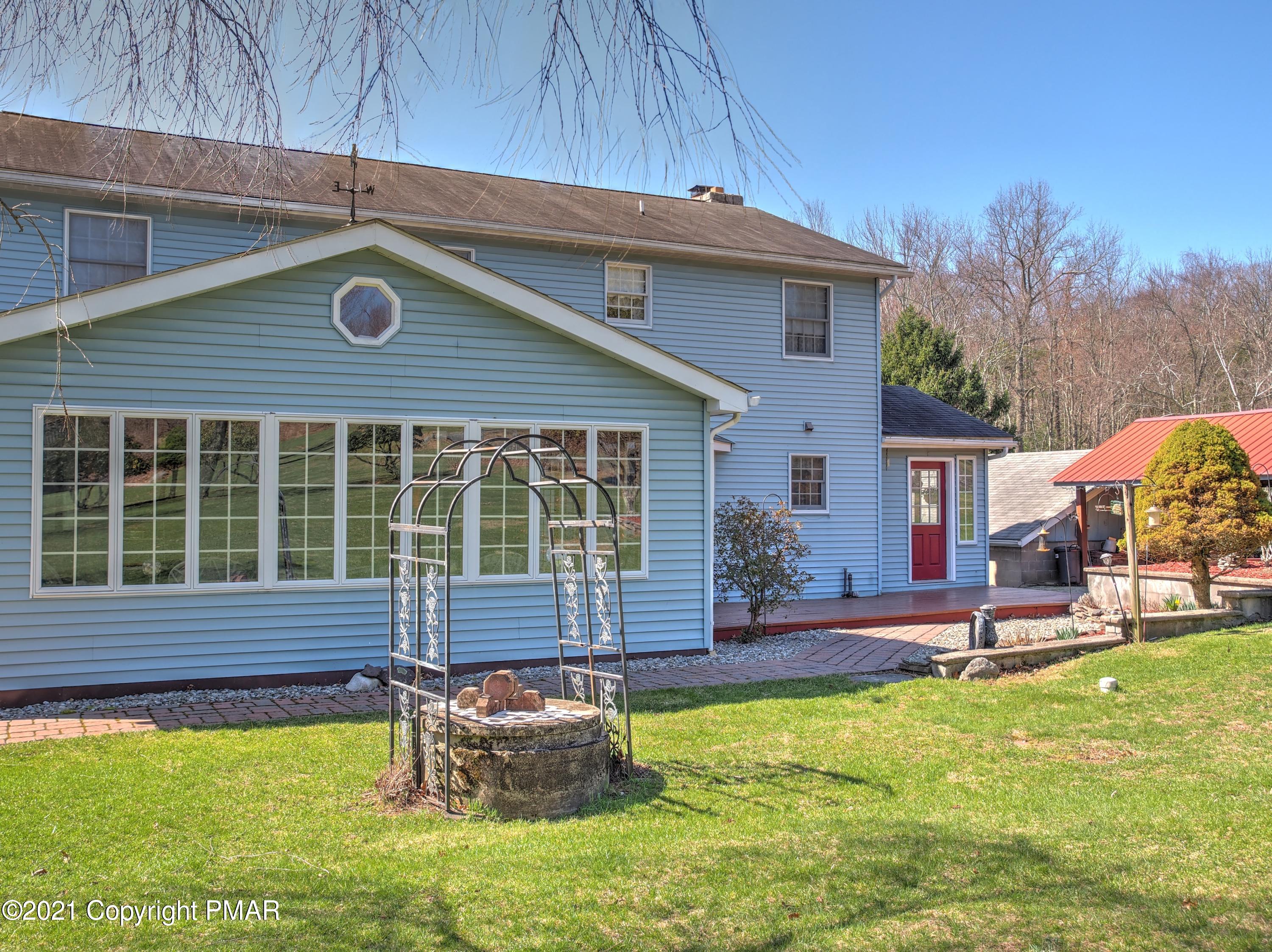 259 Babbling Brook Road Scotrun, PA 18355 - Photo 49 of 63 a front view of house with a garden and patio