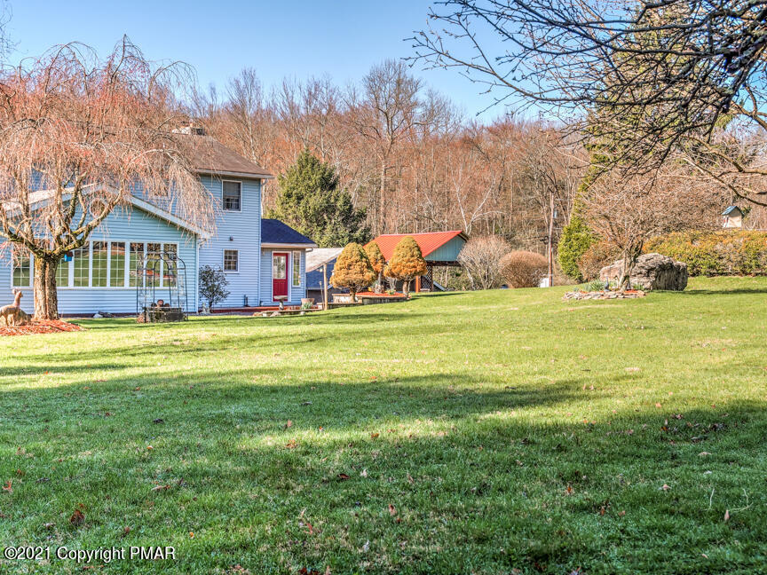 259 Babbling Brook Road Scotrun, PA 18355 - Photo 58 of 63 a view of a house with a big yard and large trees