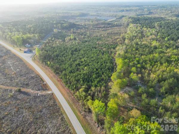 a view of a forest from a balcony