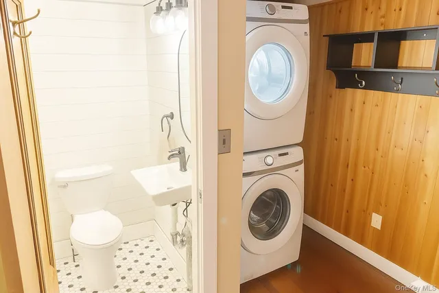 a bathroom with a sink a toilet and a shower