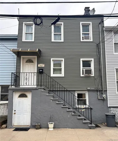 a front view of a house with garage