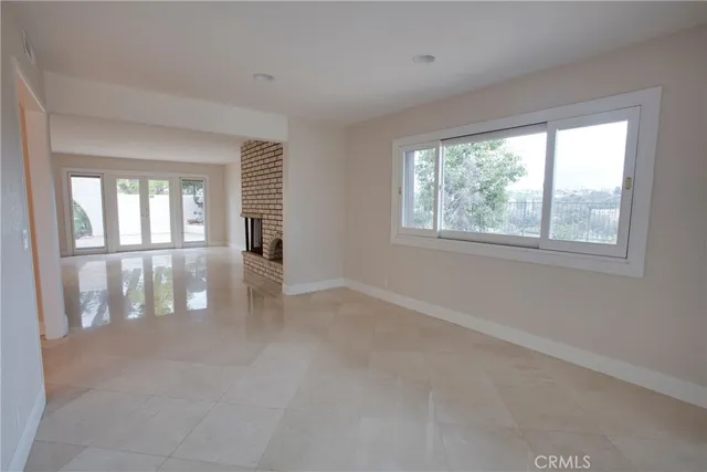 a view of kitchen with center island and stainless steel appliances