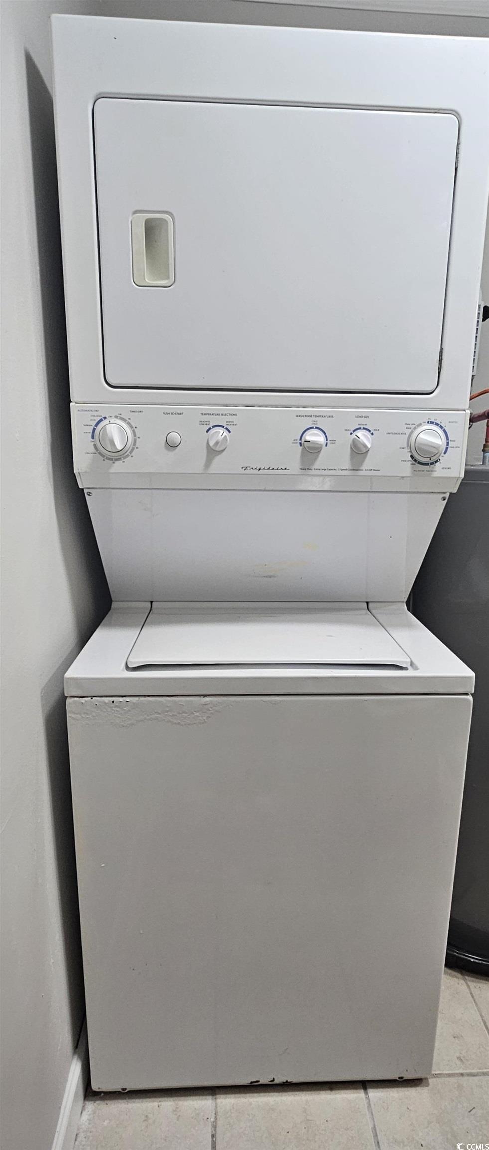 615 Carter Lane, Unit A1 Conway, SC 29526 - Photo 7 of 24 Laundry room with stacked washer / drying machine and light tile patterned floors