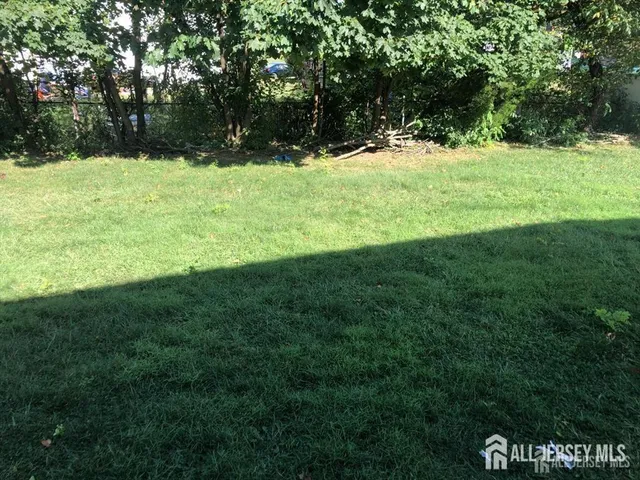 a view of outdoor space with deck and yard