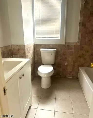 a bathroom with a sink a toilet and a bathtub