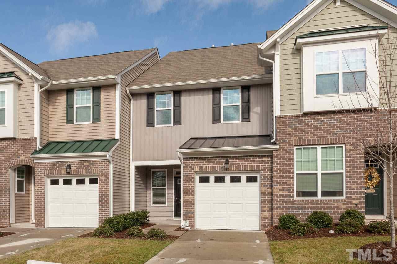 7326 Caversham Way Raleigh, NC 27617 - Photo 1 of 23 a front view of a house with a yard