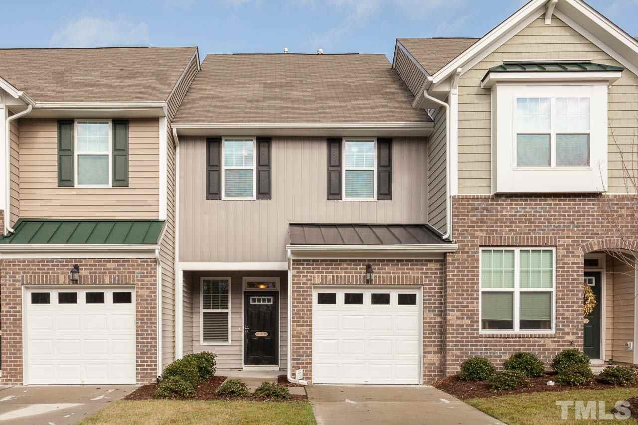 7326 Caversham Way Raleigh, NC 27617 - Photo 2 of 23 a front view of a house with a yard