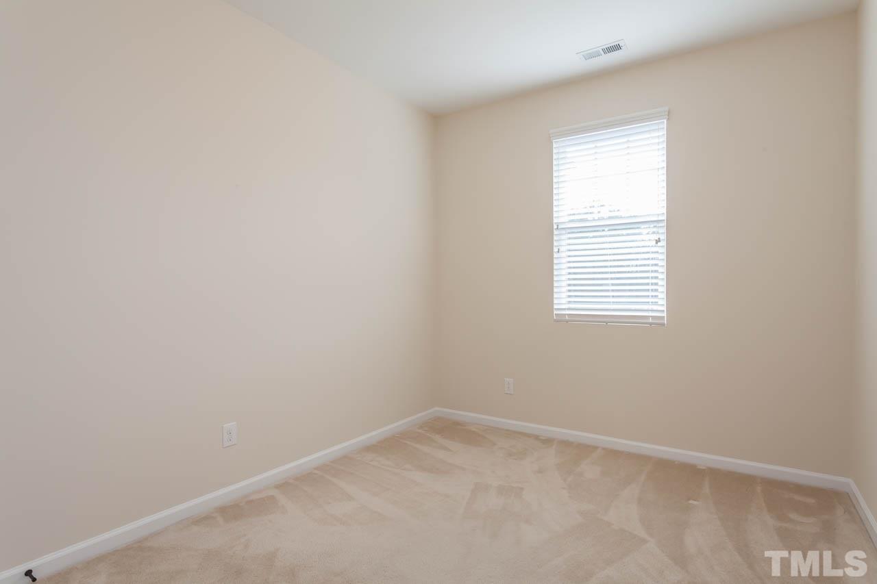 7326 Caversham Way Raleigh, NC 27617 - Photo 13 of 23 an empty room with a window