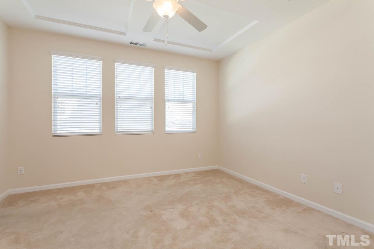 7326 Caversham Way Raleigh, NC 27617 - Photo 14 of 23 an empty room with a window