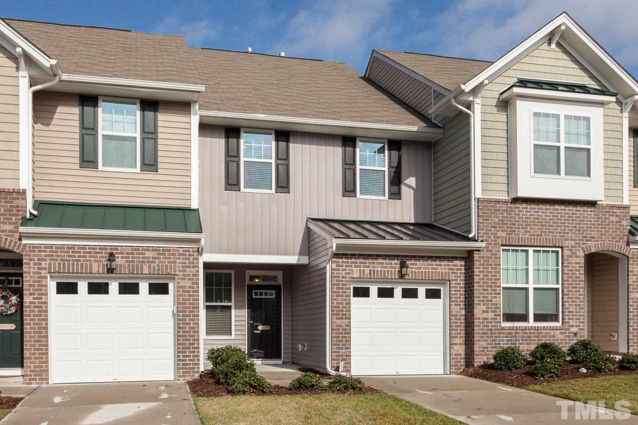 7326 Caversham Way Raleigh, NC 27617 - Photo 3 of 23 a front view of a house with a yard