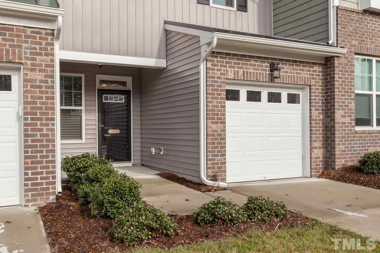 7326 Caversham Way Raleigh, NC 27617 - Photo 4 of 23 a front view of a house with a yard