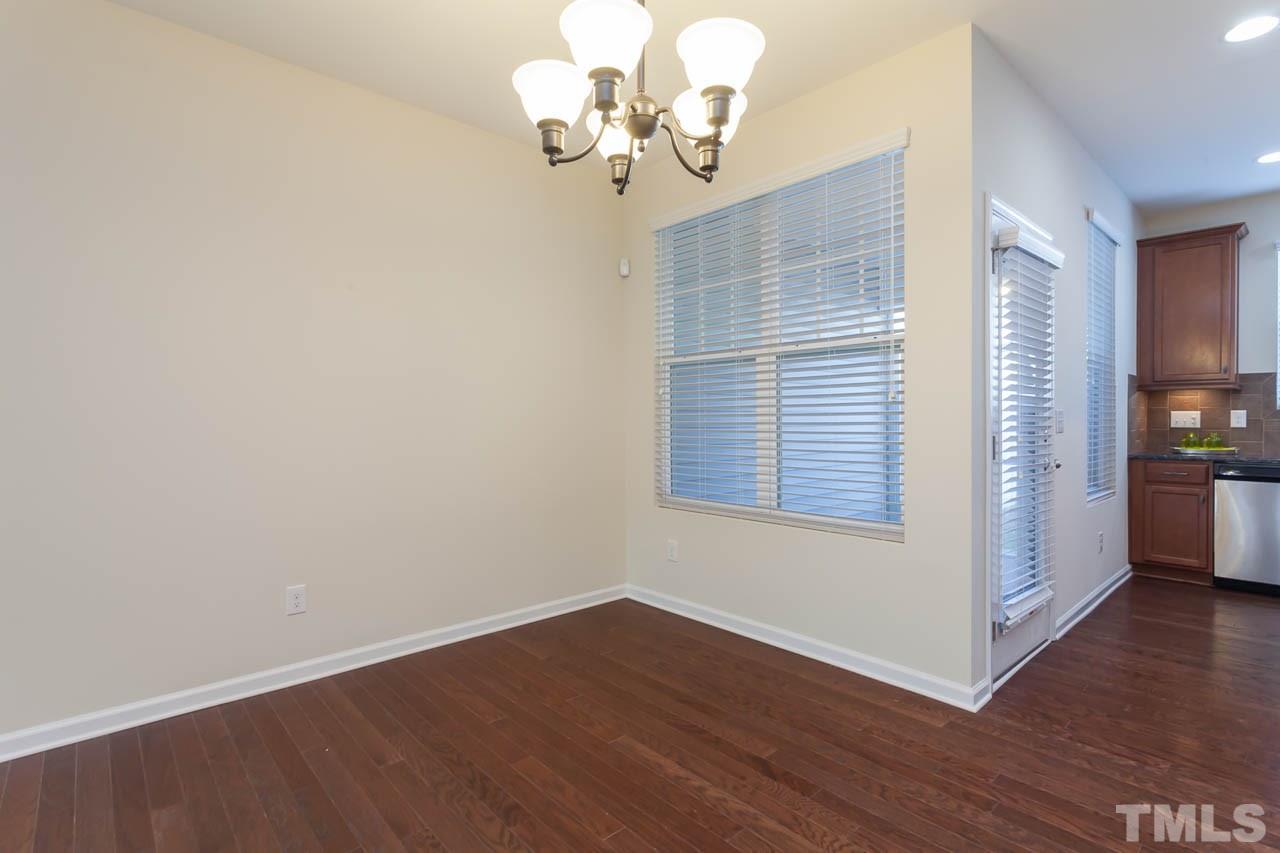 7326 Caversham Way Raleigh, NC 27617 - Photo 9 of 23 a view of a livingroom with wooden floor