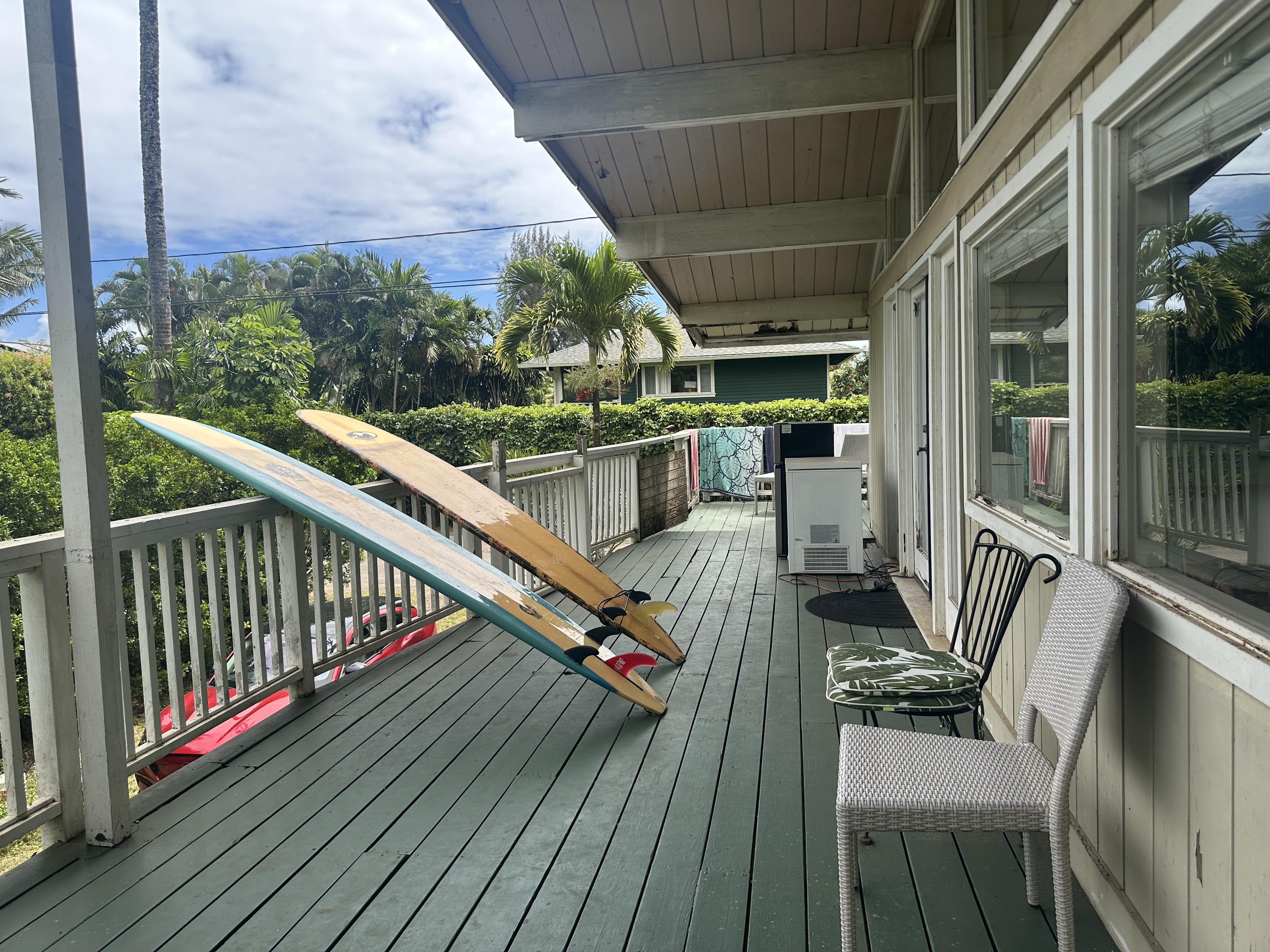 5404 Weke Road Hanalei, HI 96714 - Photo 11 of 19 a view of balcony with wooden floor and outdoor seating