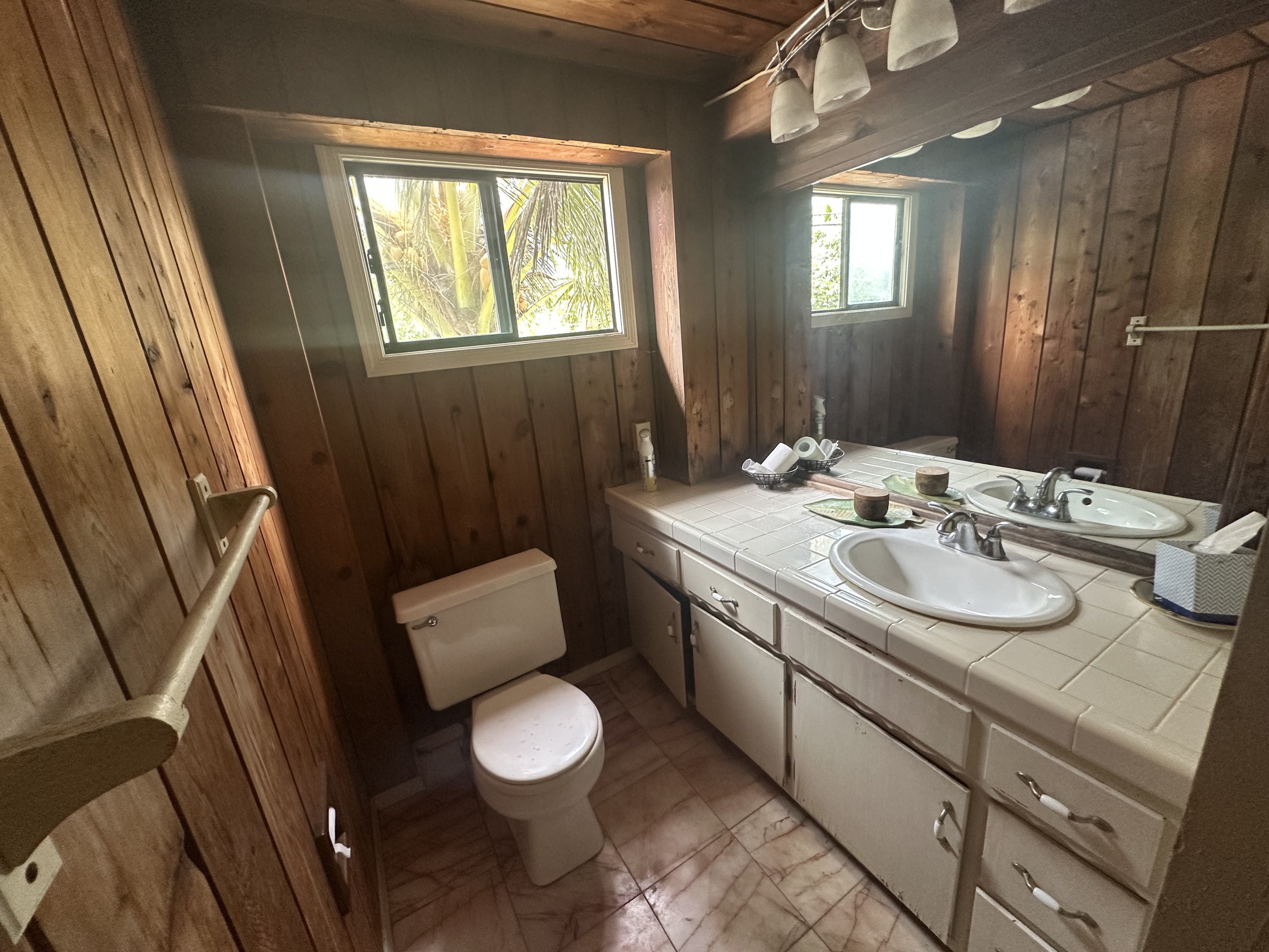 5404 Weke Road Hanalei, HI 96714 - Photo 7 of 19 a bathroom with a sink a toilet and tub