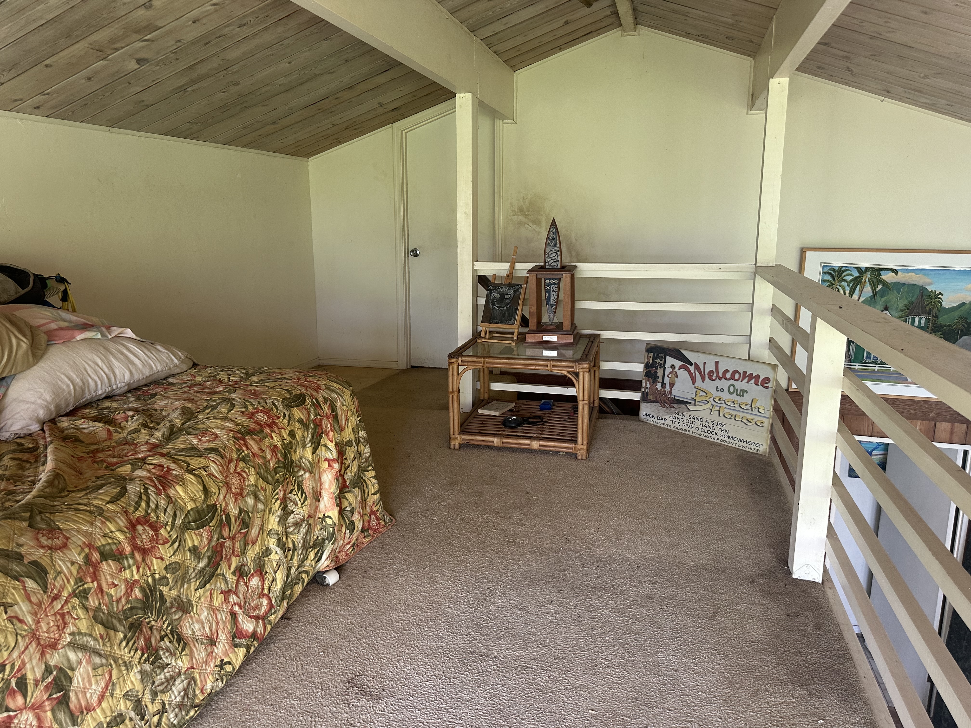 5404 Weke Road Hanalei, HI 96714 - Photo 10 of 19 a bedroom with a bed and a chair with the outer view