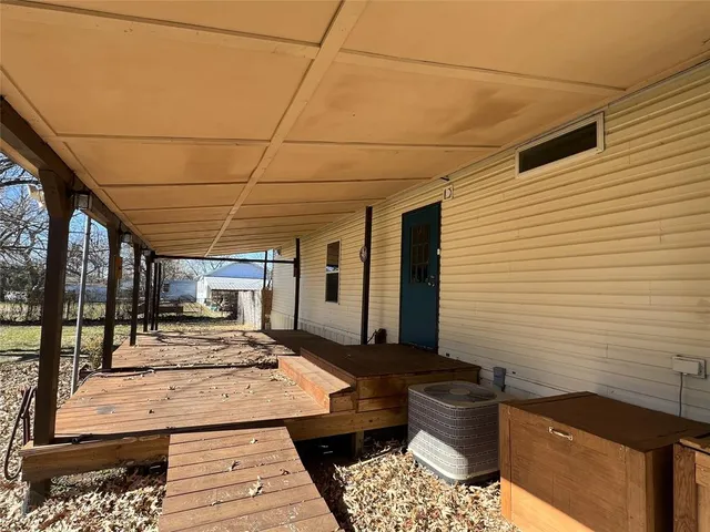 a view of a backyard with sitting area