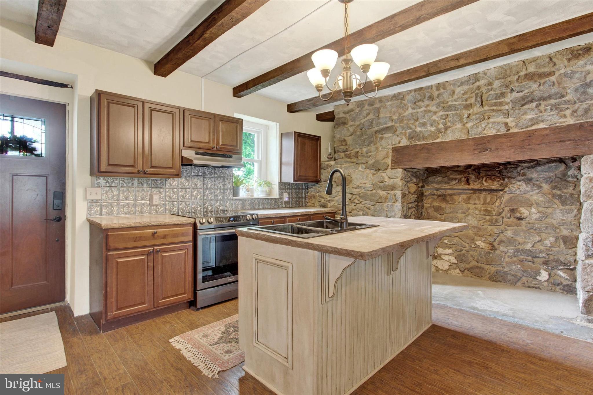 3015 York Road Gettysburg, PA 17325 - Photo 23 of 36 a kitchen with stainless steel appliances granite countertop a sink stove and refrigerator