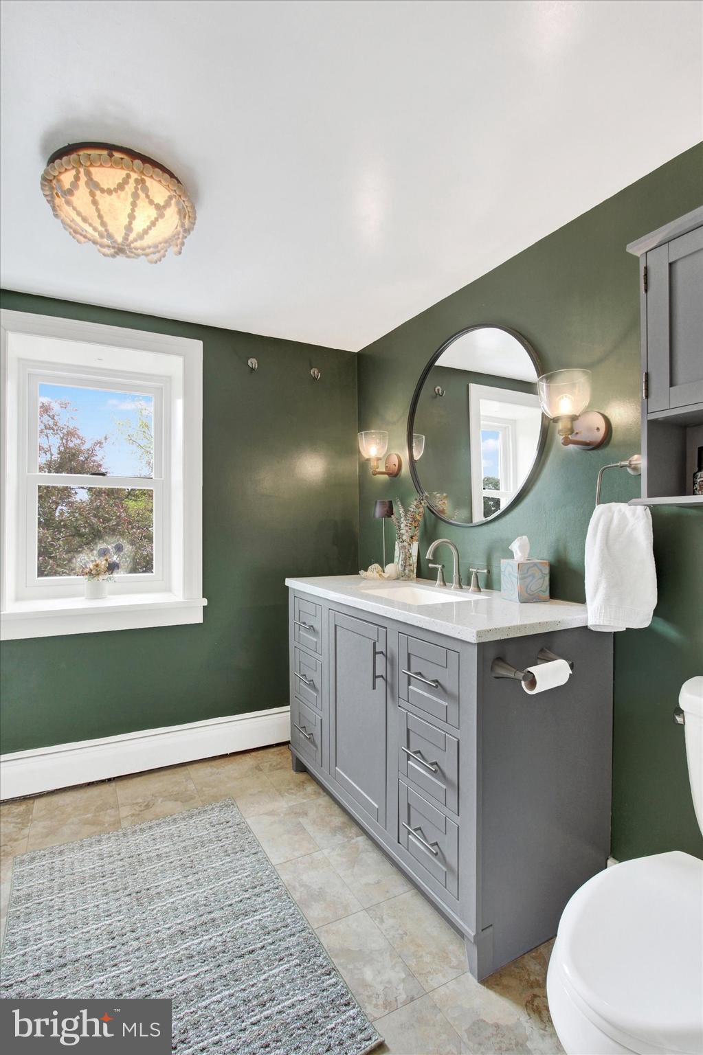 3015 York Road Gettysburg, PA 17325 - Photo 27 of 36 a bathroom with a toilet a sink and a mirror