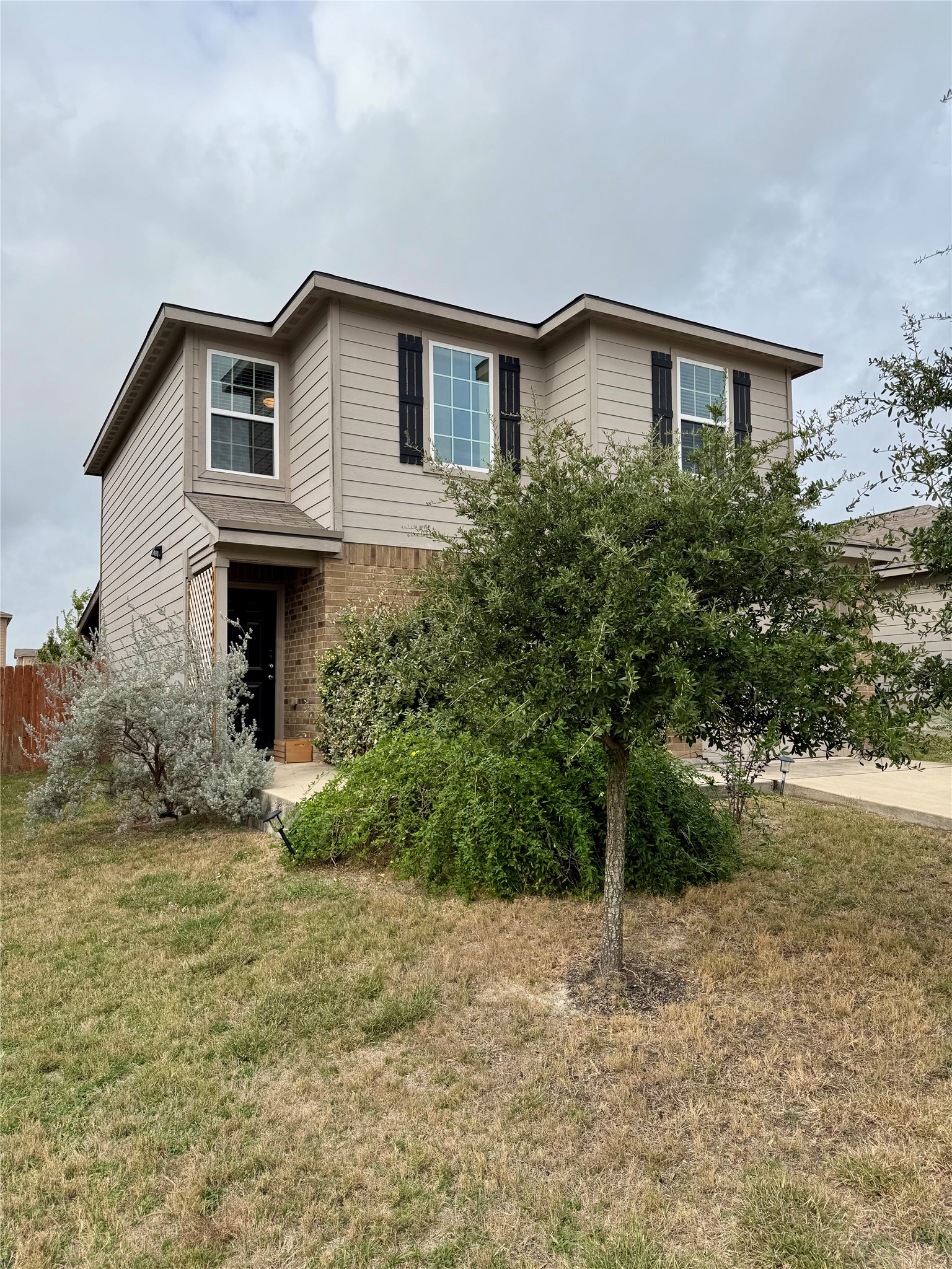 205 Denson Lane, Unit 8D Jarrell, TX 76537 - Photo 3 of 29 a house that has a lot of plants in it