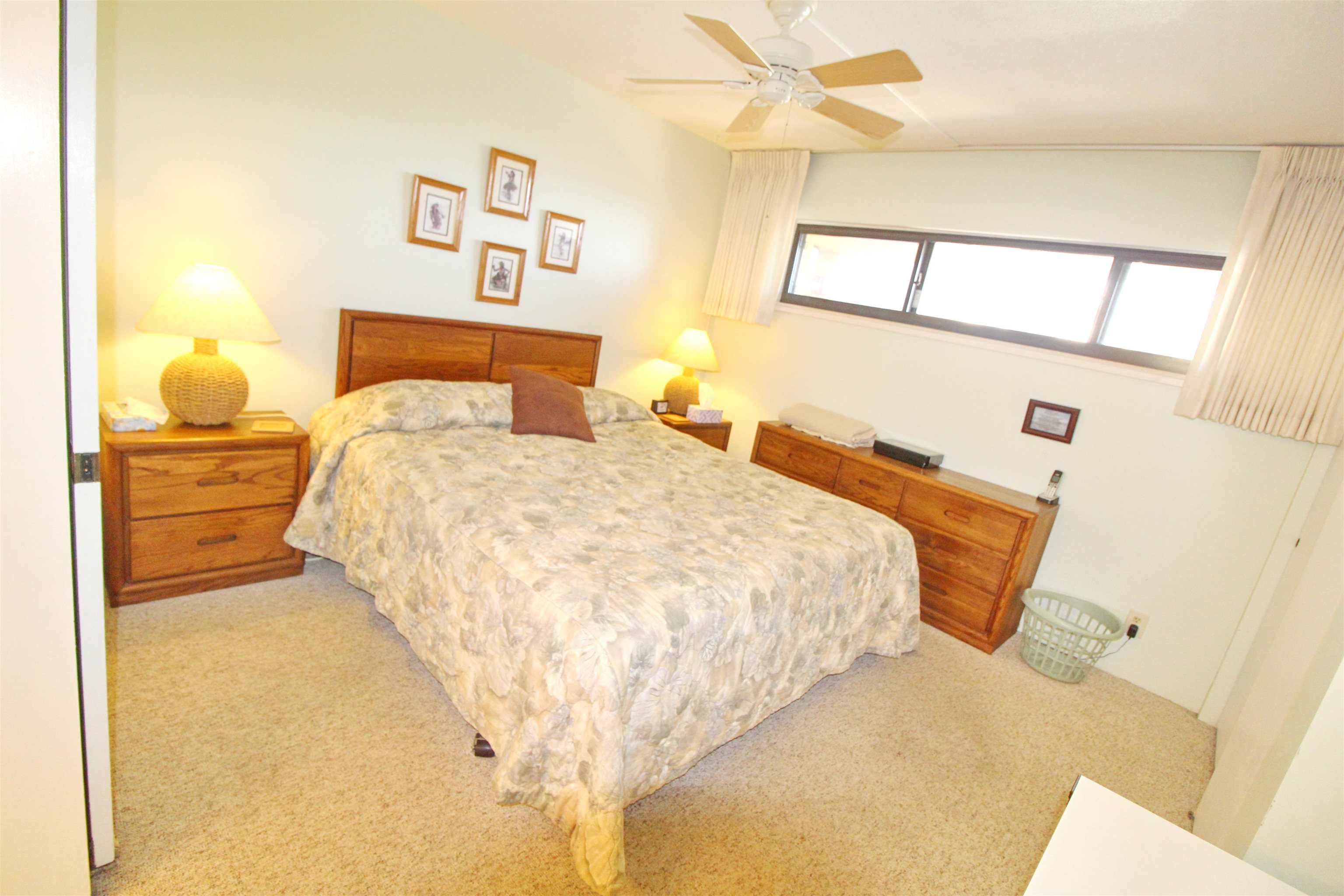 145 North Kihei Road, Unit 503 Kihei, HI 96753 - Photo 13 of 30 a bedroom with a bed and a cabinets