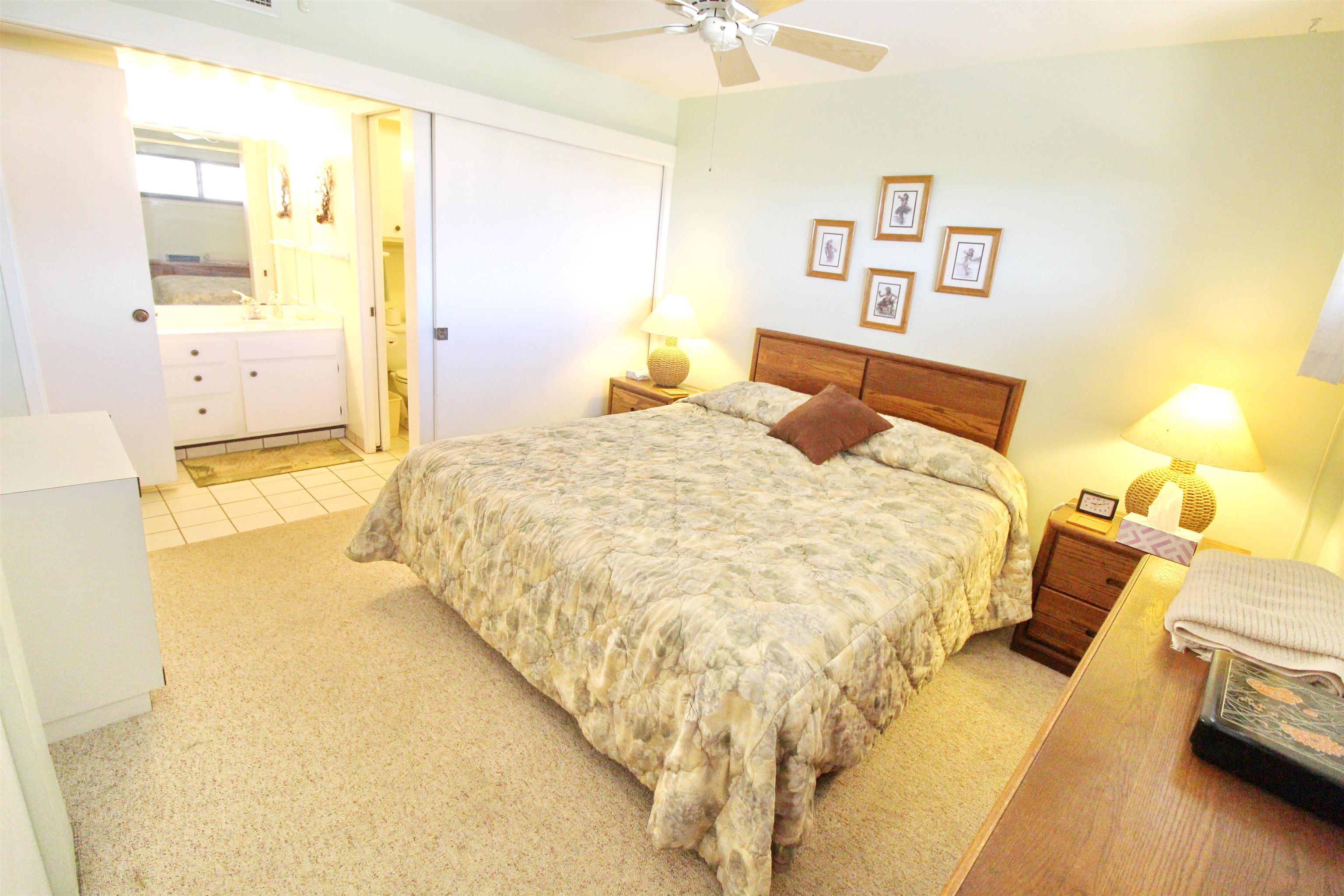 145 North Kihei Road, Unit 503 Kihei, HI 96753 - Photo 14 of 30 a bedroom with a bed and a table