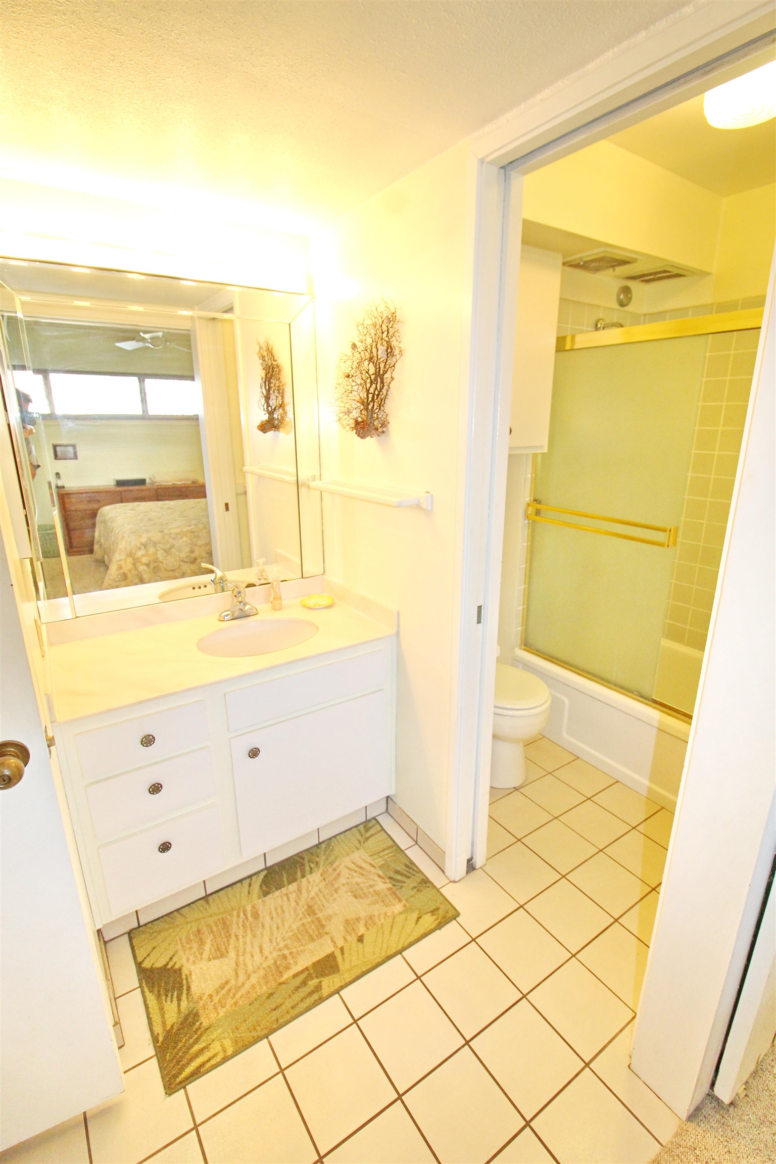 145 North Kihei Road, Unit 503 Kihei, HI 96753 - Photo 15 of 30 a bathroom with a granite countertop sink and a mirror