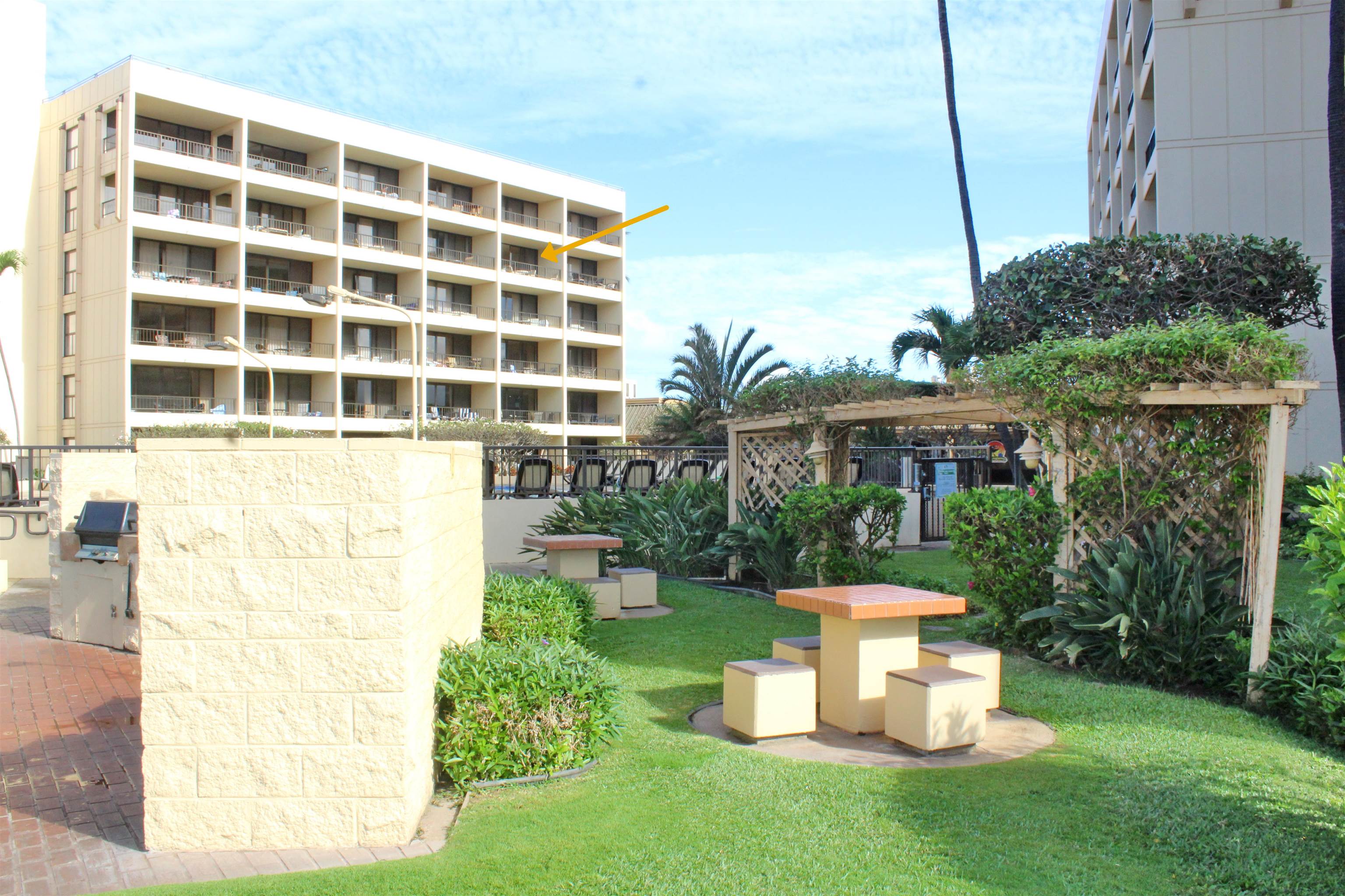 145 North Kihei Road, Unit 503 Kihei, HI 96753 - Photo 22 of 30 a view of a house with backyard sitting area and garden