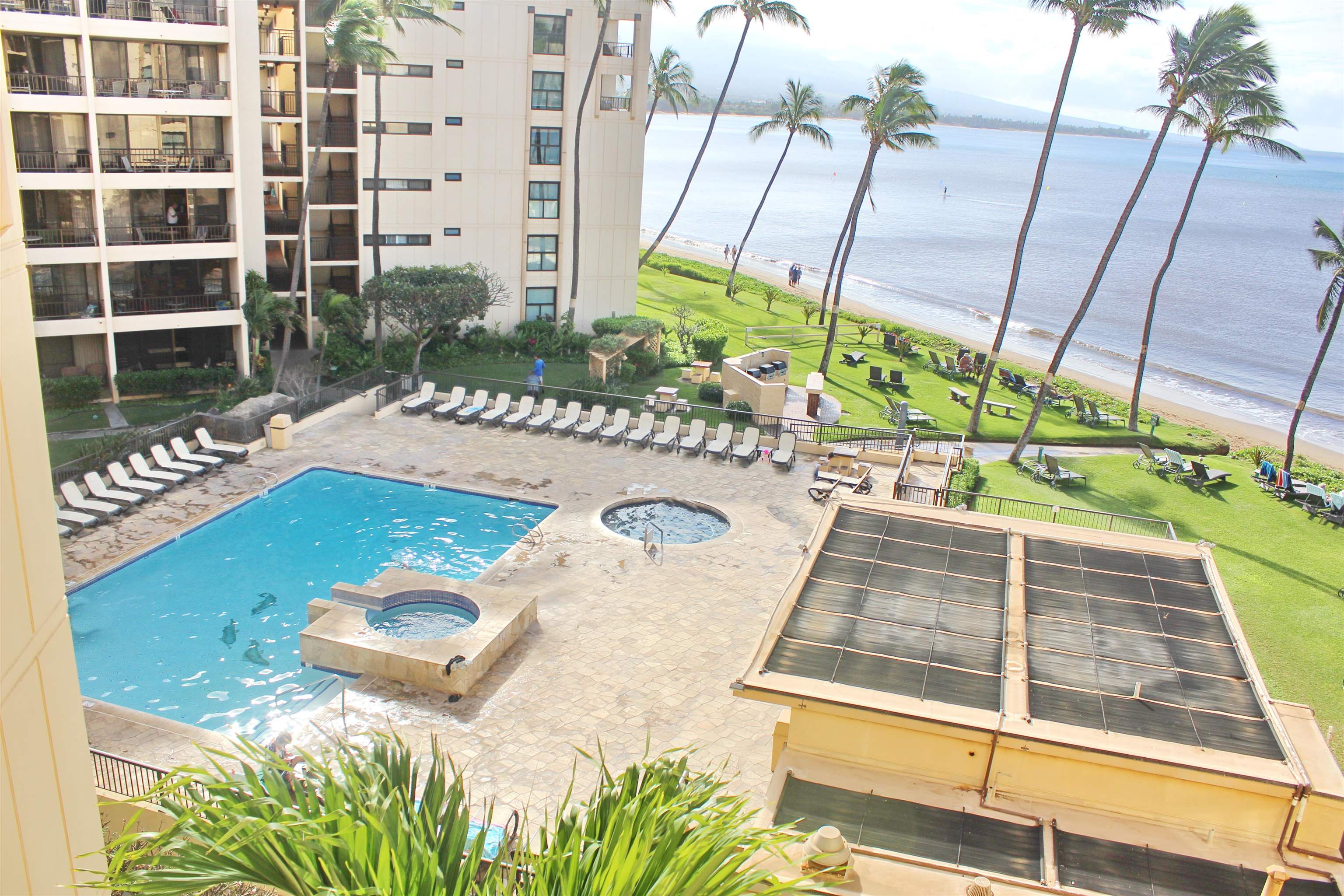 145 North Kihei Road, Unit 503 Kihei, HI 96753 - Photo 25 of 30 a view of a swimming pool with a yard