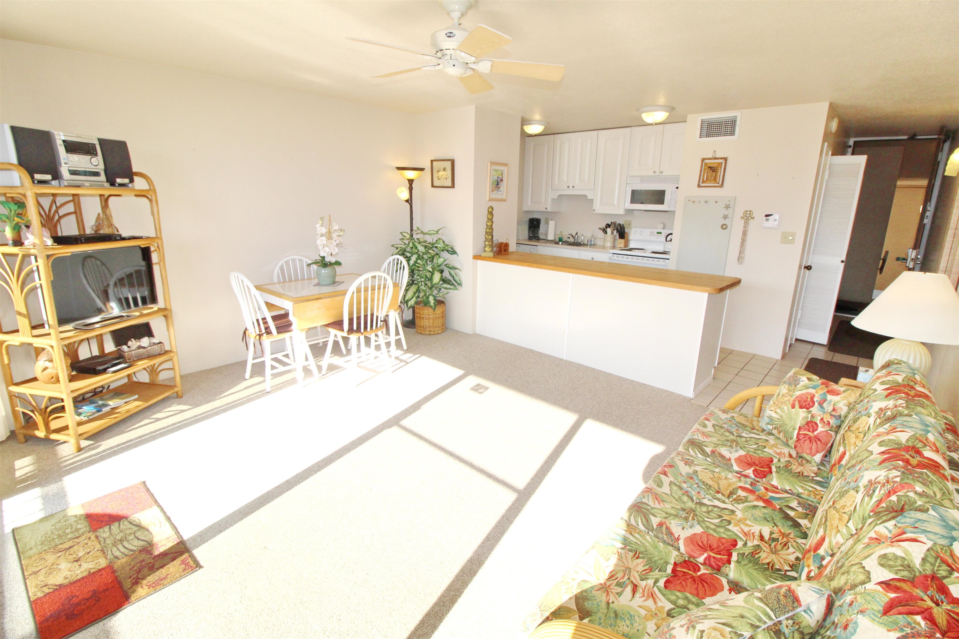 145 North Kihei Road, Unit 503 Kihei, HI 96753 - Photo 8 of 30 a living room with furniture and a flat screen tv