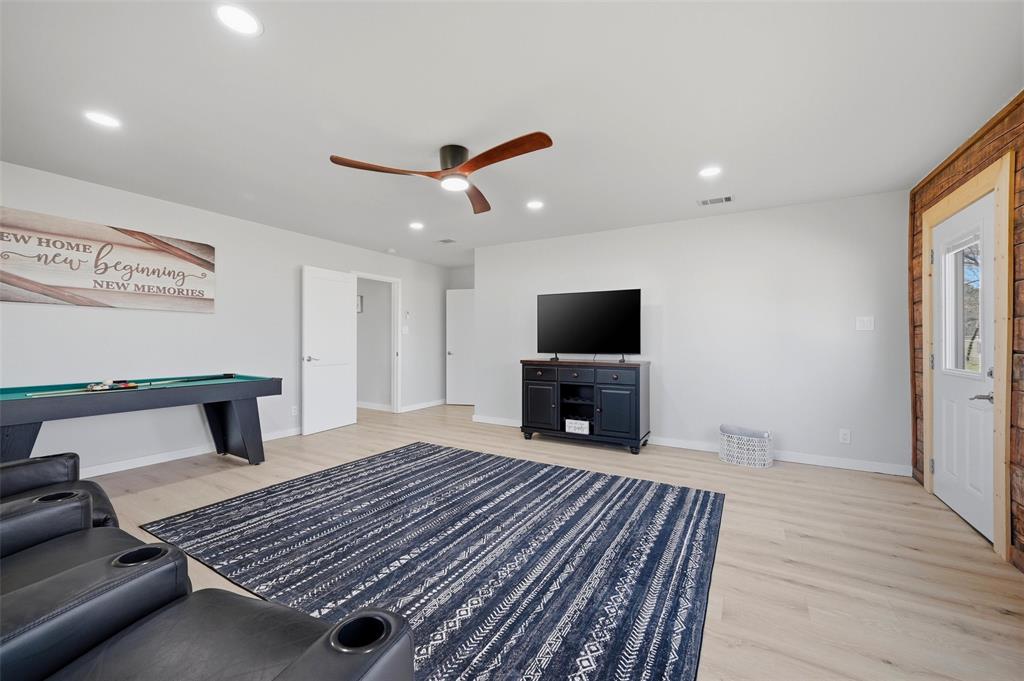 230 Frosty Hollow Road Denison, TX 75021 - Photo 20 of 40 a living room with furniture and a flat screen tv