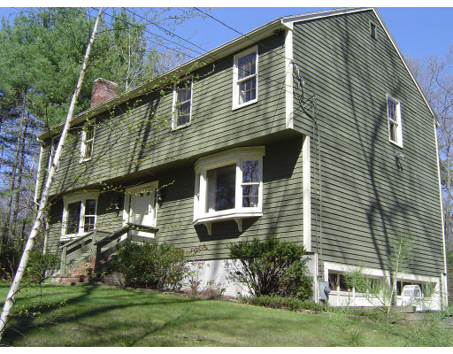16 Johnson Road Sutton, MA 01590 - Photo 1 of 7 a front view of a house with a yard