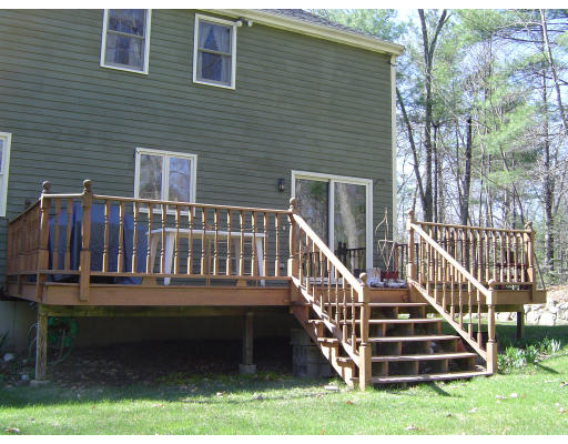 16 Johnson Road Sutton, MA 01590 - Photo 3 of 7 a view of a deck with a yard