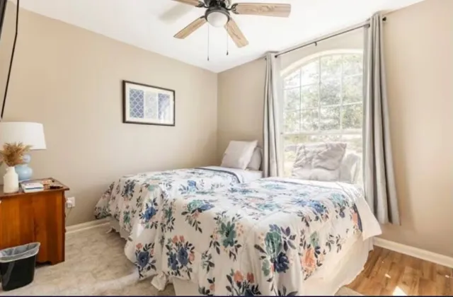 a bedroom with a bed and a window