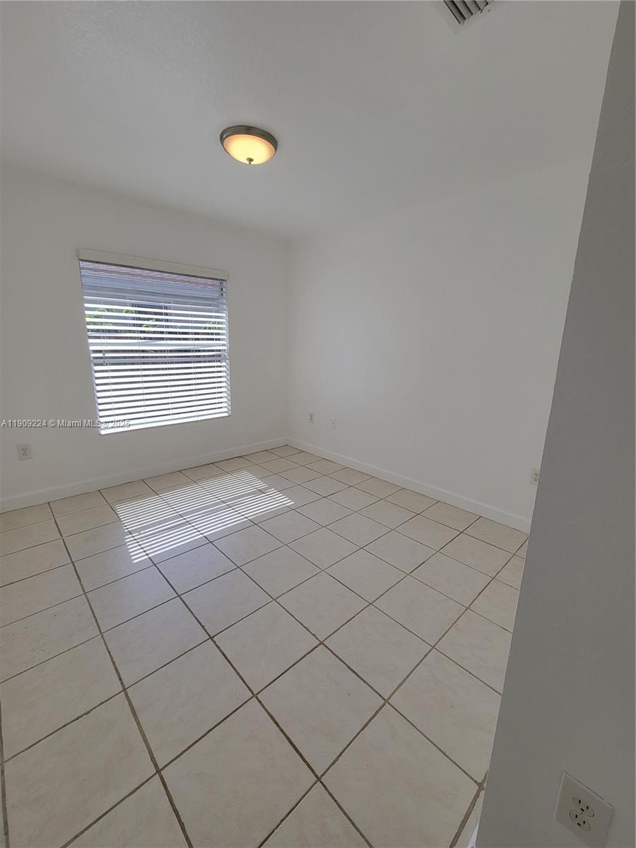 35 Southwest 7th Street, Unit 2 Hallandale Beach, FL 33009 - Photo 13 of 23 a view of an empty room and window