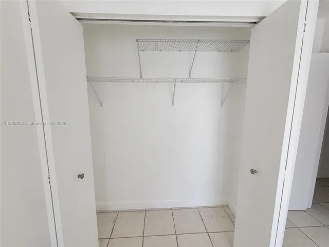 a view of an empty walk in closet