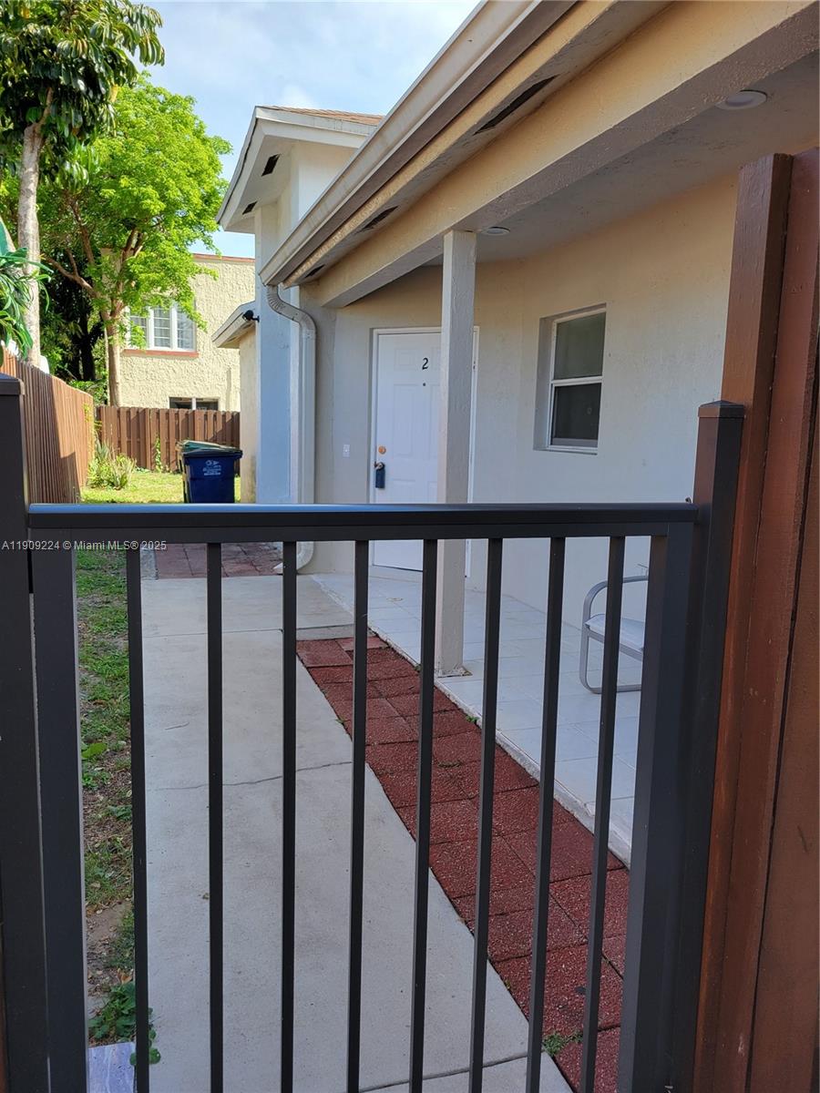 35 Southwest 7th Street, Unit 2 Hallandale Beach, FL 33009 - Photo 2 of 23 a view of a house with backyard and deck